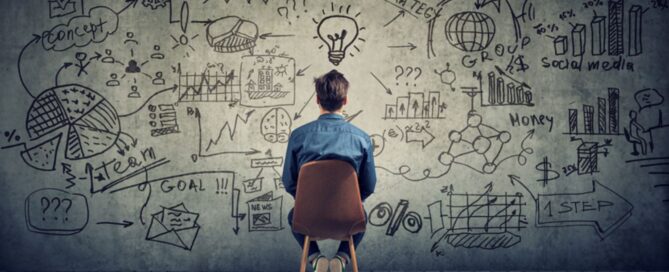 a man planning in front of wall