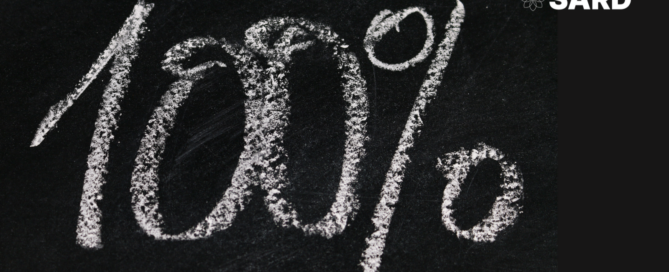Black chalkboard with text: 100% written in chalk. White SARD logo top right.